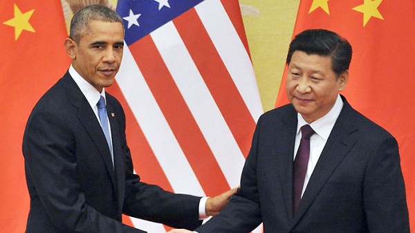 BEIJING, China - Chinese President Xi Jinping (R) and U.S. President Barack Obama attend a joint press conference in Beijing on Nov. 12, 2014, following their meeting. They agreed to reduce the risk of military conflict and combat climate change. (Kyodo)
